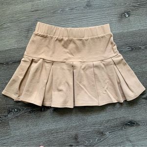 Tan pleated skirt from papaya. Never worn, only washed once. Great condition.